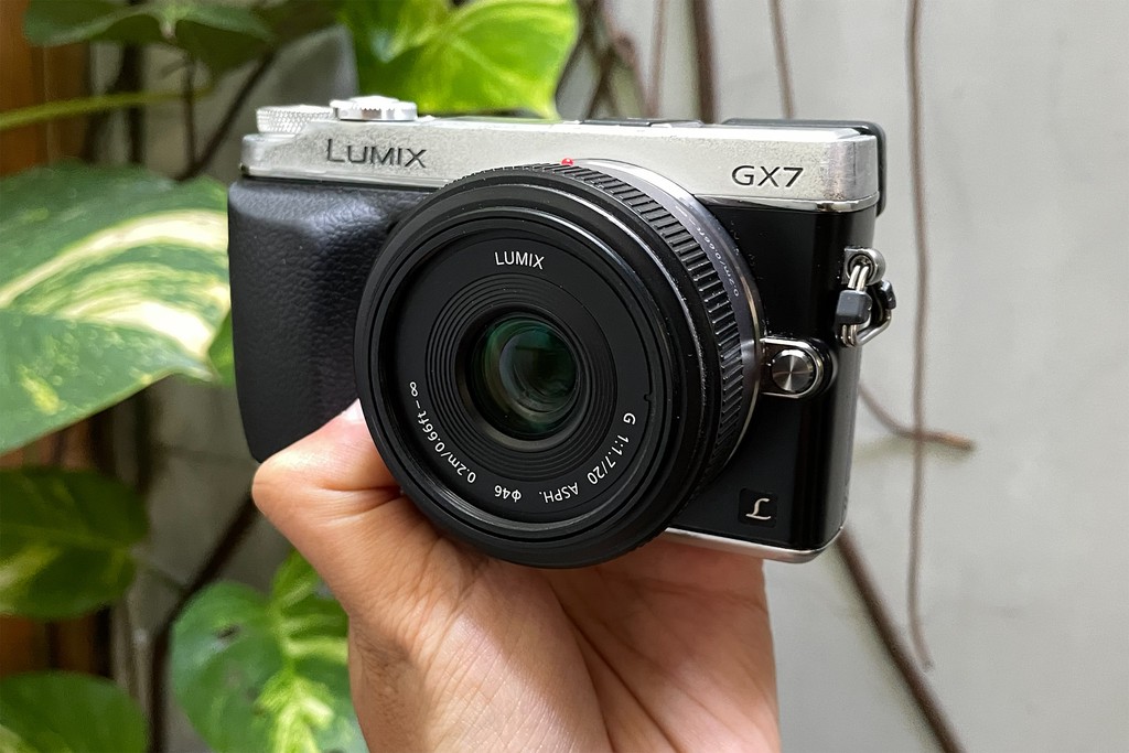 Panasonic Lumix GX7 camera being held on hand